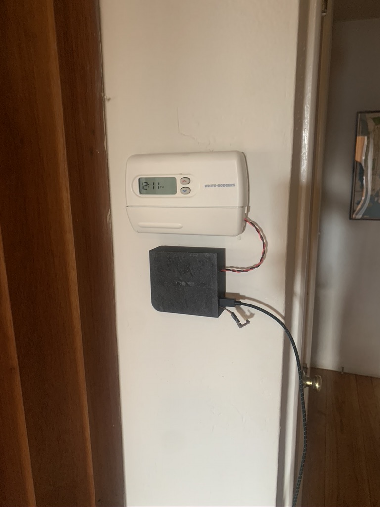 Enclosure mounted to wall and plugged in